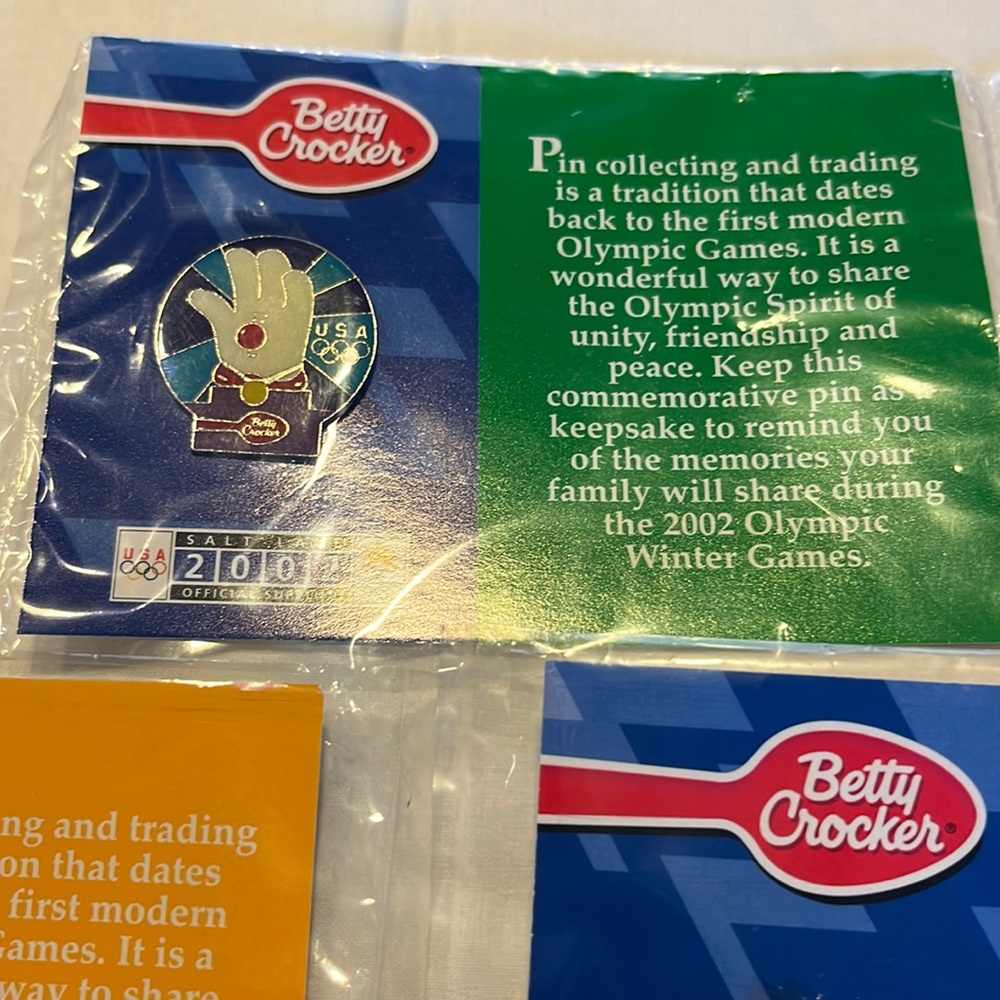 Set of 5 - Betty Crocker 2002 Olympic (Salt Lake) pins.  New in packaging